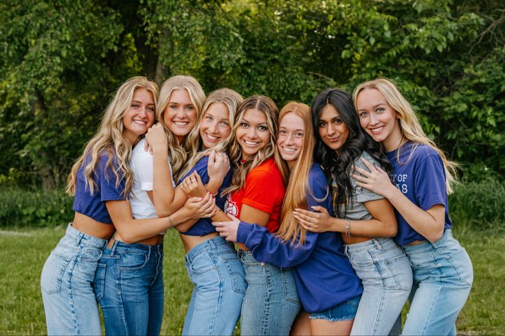 a group of young women standing next to each other