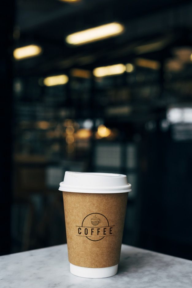 a coffee cup sitting on top of a table