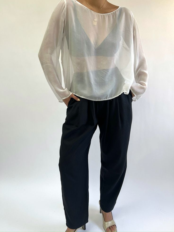 The Lena Pant is our classic go-to pant, essential and styles virtually across every piece from our In-House Line. The Lena Pant features a comfortable elastic waist, handsome front pleats, side pockets, with a slightly tapered leg. We love pairing the Lena Pant in silk herringbone with our coveted Mary Margaret Top that truly makes for a day to evening affair look! Our Silk Herringbone fabrication shares a stunning textural quality that's reminiscent of our absolute favorite vintage menswear pi Relaxed Fit Bottoms With Pleated Waist For Daywear, Elegant Pull-on Pants For Daywear, Effortless Workwear Bottoms With Elastic Waistband, Effortless Relaxed Fit Tapered Leg Pants, Effortless Bottoms With Elastic Waistband For Work, Effortless High-waisted Loose-fit Pants, Loosely Fitted Tapered Leg Bottoms For Daywear, Tapered Leg Pants With Elastic Waistband For Daywear, Classic Ankle-length Wide Leg Pants For Daywear