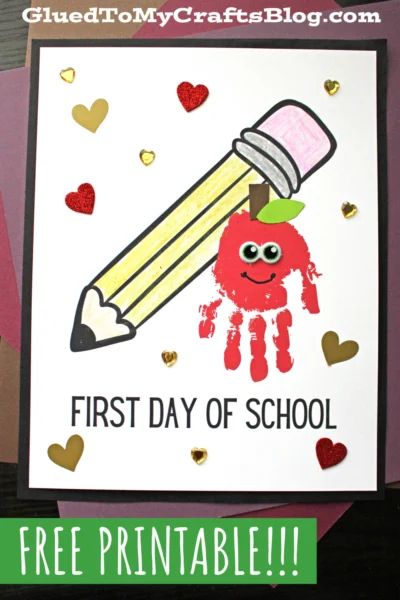 a handprinted card with an apple holding a pencil and the words first day of school