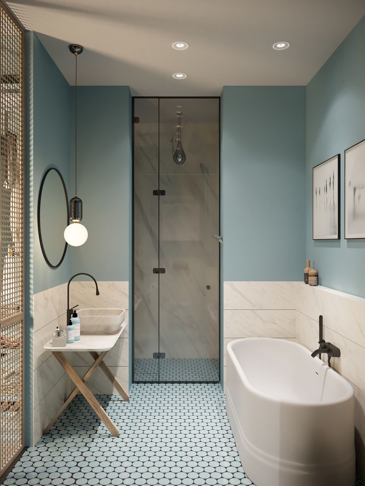 a bathroom with blue walls and flooring, including a white bathtub next to a walk in shower