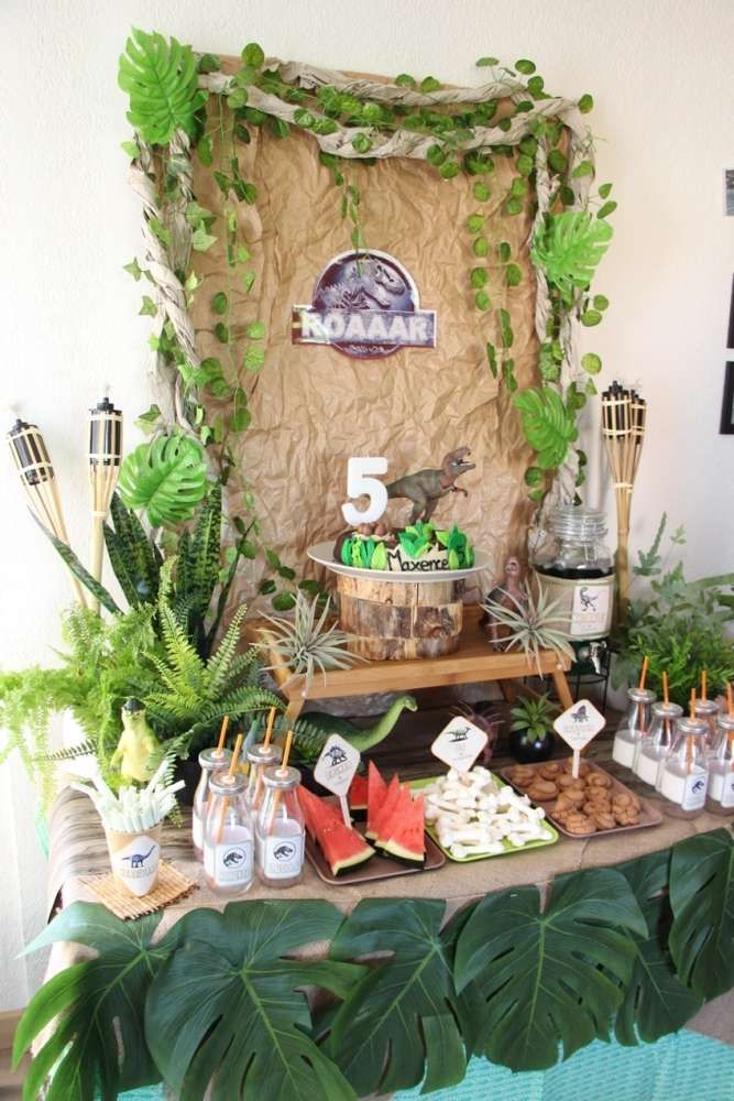 a table topped with lots of food and plants