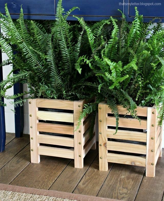 two wooden planters sitting on top of a wooden floor