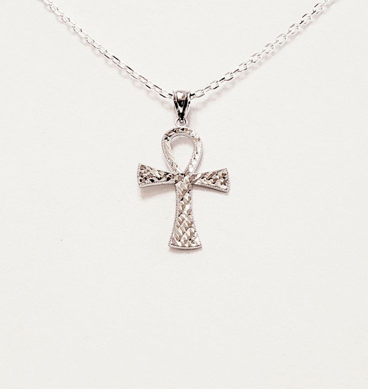 "- Awesome Silver Hammered Ankh Egyptian Christian Cross Pendant, Necklace, in solid textured 925 Sterling Silver with Silver Self-Bail. Chain and Lobster Clasp included. Photos #1-5. - Front of the Cross has Hammered, or Textured \"Cuts\" that give it a lot of sparkle. - Back of the Cross in equally beautiful but has less sparkle. See Photo #5. - Cross measures 1 3/8 x 7/8\" and drops 1 5/8\" from the Chain. Cross is reversible and has different pretty look on the back. - Chain Length 20\". - 9 Silver Diamond Cut Cross Pendant Necklace, Silver Cross Necklace With Diamond Cut, Silver Ankh Jewelry For Anniversary, Sterling Silver Ankh Engraved Jewelry, Silver Ankh Hallmarked Jewelry, Sterling Silver Ankh Necklace In Silver, Hallmarked Silver Ankh Jewelry, Ankh Egyptian, Sand Dollar Pendant