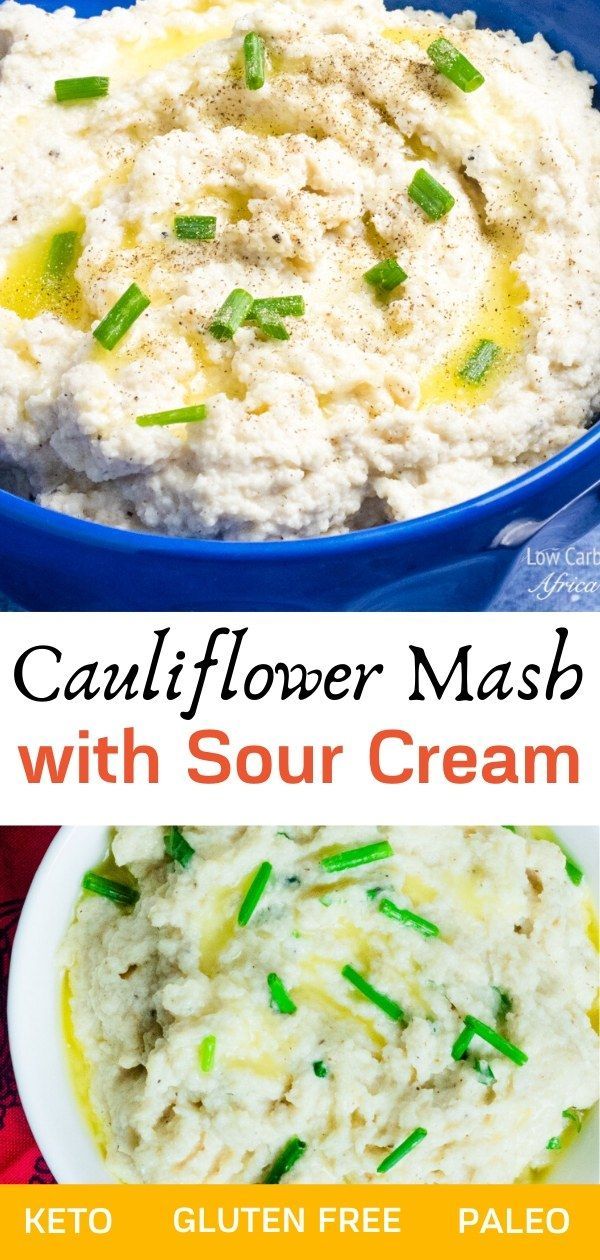 cauliflower mash with sour cream in a blue bowl and green onions on the side