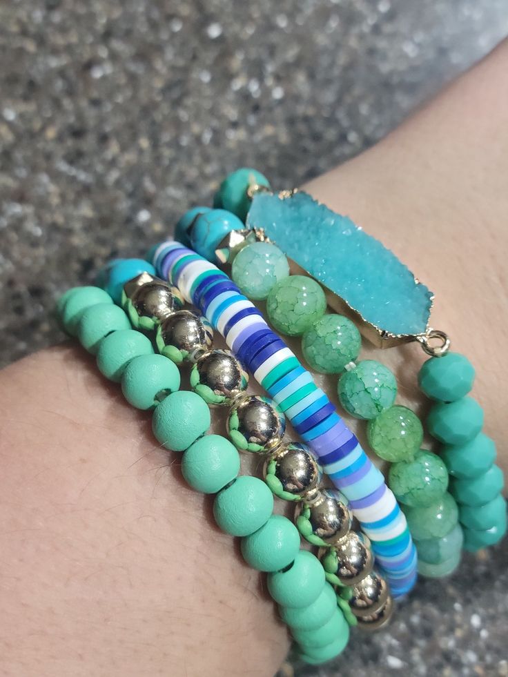 Blue and gold racelet Stack. Comes with all bracelets pictured. Great for mixing and matching with other colors too! Casual Green Stackable Bracelets, Trendy Turquoise Stackable Beaded Bracelets, Casual Turquoise Bracelets With Colorful Beads, Blue Stackable Stretch Bracelet, Trendy Blue Stackable Stretch Bracelet, Stackable Blue Stretch Bracelet, Blue Stackable Wrap Bracelet As Gift, Adjustable Blue Stackable Wrap Bracelet, Trendy Blue Bangle Bracelets