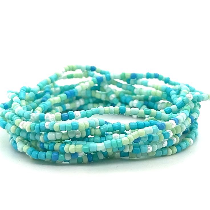 A stack of Super Silver Dainty Beaded Bracelets on a white background. Turquoise Beaded Friendship Bracelets For Summer, Heishi Beads Multi-strand Bracelets For Beach, Summer Friendship Bracelets With Tiny Turquoise Beads, Turquoise Friendship Bracelets With Colorful Beads For Summer, Turquoise Friendship Bracelets With Tiny Beads For Summer, Turquoise Summer Friendship Bracelet With Tiny Beads, Summer Turquoise Friendship Bracelets With Colorful Beads, Turquoise Friendship Bracelet With Tiny Beads, Trendy Turquoise Bracelets With Tiny Beads