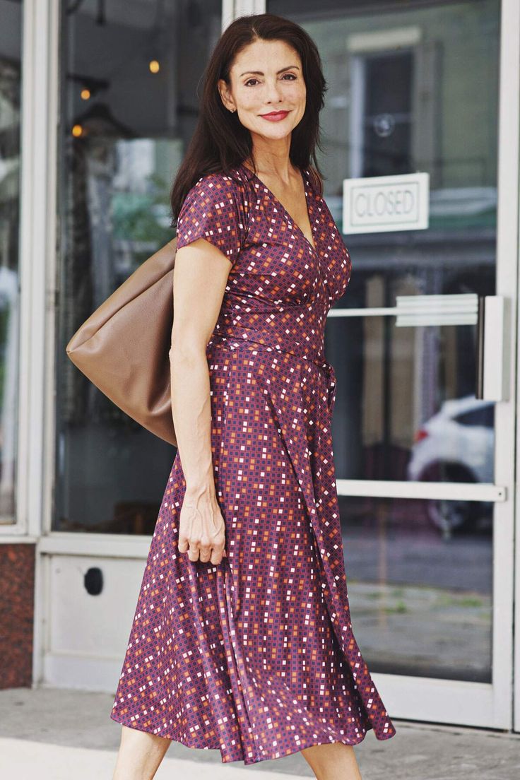 The cross-over V neck bodice and attached sash accentuate your figure, while the wrinkle-free fabric (polyester/spandex) makes it easy to care for. Dress it up or down for any occasion. Proudly made in the U.S.A. Margaret Dress Length: XS: 46" - S/M: 46.5" - M/L: 47" - XL: 47.5" - XXL: 48" - 3XL: 48.5" - 4XL: 49" Meet The ModelName: ConnieKarina Size: S/M Fall Mini Dress With V-neck And Printed Details, Wife Fashion, The Purple, Wrinkle Free, Free Fabric, Empire Waist, Purple Dress, Autumn Summer, Cocktail Party