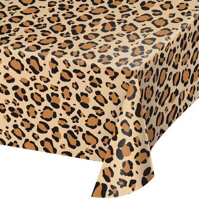 a leopard print table cloth with an animal print pattern on the front and back side