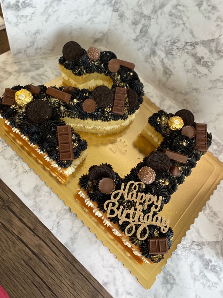 a birthday cake with chocolate decorations on it