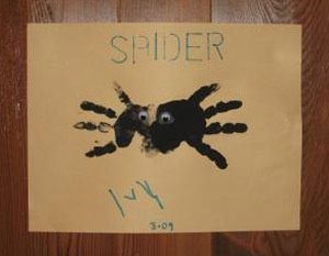 a handprint on a piece of paper that says spider