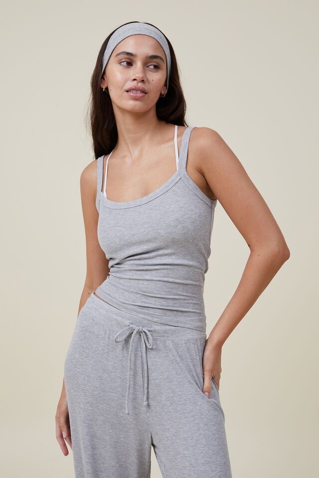 Sleep Recovery Scoop Neck Singlet Ribbed Camisole With Spaghetti Straps For Loungewear, Ribbed Spaghetti Strap Camisole For Loungewear, Stretch Spring Tank Top For Loungewear, Stretch Tank Top For Spring Loungewear, Casual Sleeveless Camisole With Seamless Construction, Casual Seamless Sleeveless Camisole, Casual Sleeveless Seamless Camisole, Fitted Cami Tank Top For Loungewear, Solid Color Cami Tank Top For Loungewear