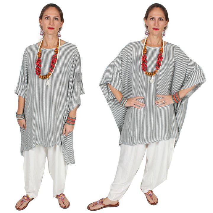 Austria Moroccan Cotton Poncho Tunic Top • Bust - Hips 94" • Sleeve width 22"• Length 30"-33" Our best-selling generously designed over-size tunic top. Everyone, love the Mirage Poncho that is so flattering to all figures. Because hand-woven Moroccan Cotton sousdie is like jersey knit (remember those fabulous 1940's dresses?) it drapes like a dream. So wear it loose like the model or belted for a more ethnic look. Soft, luxurious and a goodly weight- that's why we call it the Cashmere of cotton! Oversized Summer Poncho For Layering, Oversized Poncho For Summer Layering, Casual Flowy Tunic For Loungewear, Flowy Casual Tunic For Loungewear, Fall Tunic For Loungewear, Casual Long Sleeve Kaftan One Size, Relaxed Fit Tunic Top In Lagenlook Style, Relaxed Fit Lagenlook Tunic Top, Casual Free Size Tunic With Batwing Sleeves