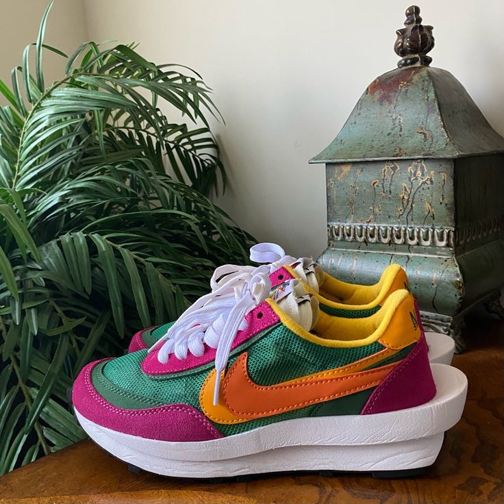 Nike Sacai Sneakers Women’s Size 7 Color: Pine Green Ld Waffle Sacai Pine Green Bright Magenta And Clay Orange Del Sol Sneakers In A Vibrant Color. Layered Suede Two-Tone Swooshes Twin Tongues, Double Laces Stacked Heel Logos Double Stacked Sculpted Midsole Waffle Tread Sneakers Are Preowned, May Have Normal Or Cosmetic Wear But Are Still In Good Condition. Please See All Pictures For Details. Box Is Not Included. Waffle Sacai, Clay Orange, Nike Sacai, Green Sneakers, Sneakers Women, Pine Green, Stacked Heel, Womens Shoes Sneakers, Pink And Green