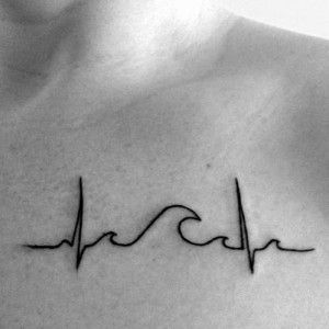 a black and white photo of a heartbeat tattoo on the back of a man's chest