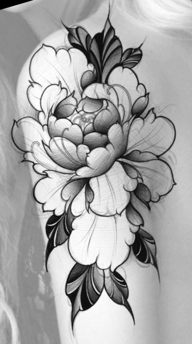 a black and white photo of a woman's shoulder with flowers on it,