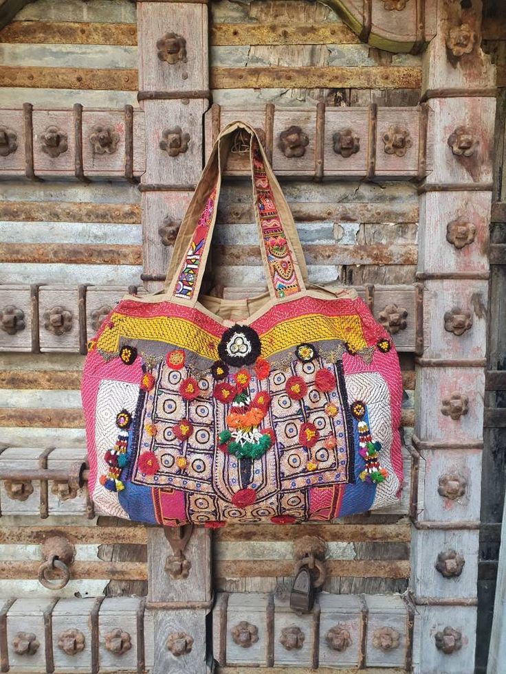 About bag  Indo-gypsy fusion, everyday use hand bag made from Banjara fabrics sourced from Vintage tribal costumes of regions of Rajastan and Gujarat. These are embellished with light catching coins, and intricate bead work tassels. Size - length 16 inches/ width 26 inches Company details:  Company name: Houseoftextile  Contact number: +919784447473  Email id: houseoftextile77@gmail.com  Shipping & custom : Delivery through one of the finest service providers : Skyway, Fedex, UPS  And DHL. Any l Traditional Handmade Multicolor Embroidered Hobo Bag, Traditional Handmade Multicolor Embroidery Hobo Bag, Hand-stitched Multicolor Embroidery Festival Bags, Traditional Handmade Multicolor Hobo Bag, Handmade Multicolor Embroidered Hobo Bag For Festivals, Traditional Multicolor Embroidered Hobo Shoulder Bag, Traditional Multicolor Embroidered Hobo Bag, Handmade Embroidered Hobo Bag For Festivals, Bohemian Hand-stitched Bags