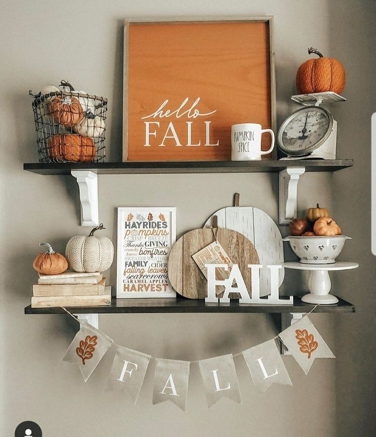 a shelf filled with fall decorations and other items