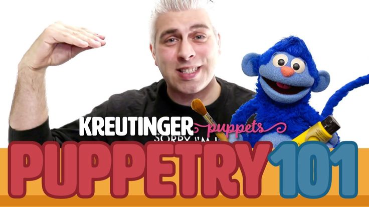 a man holding a microphone next to a blue stuffed animal and the words puppetty 1011