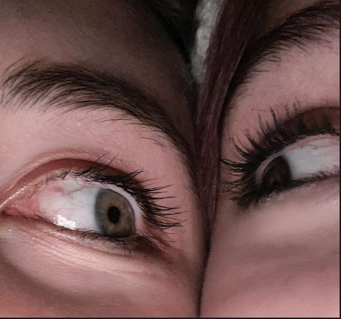 two women's eyes with long eyelashes are shown