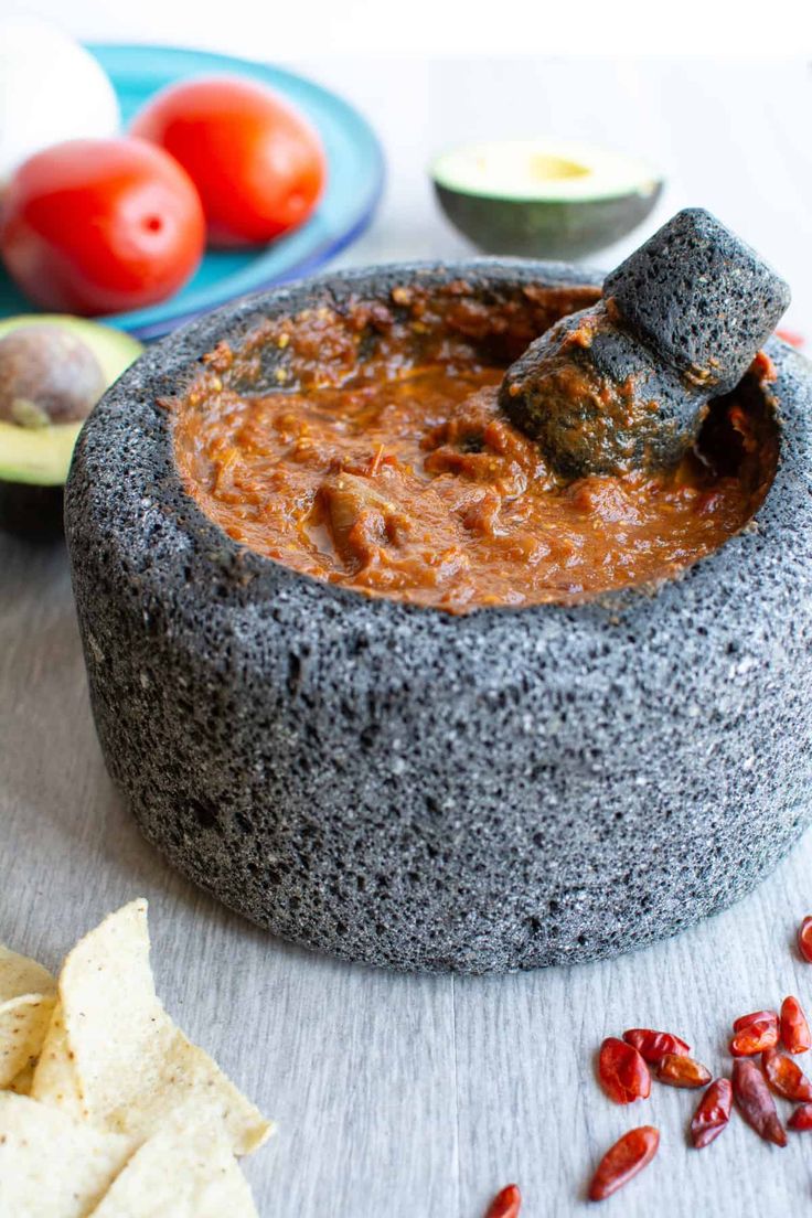 a tortilla bowl filled with salsa and chips