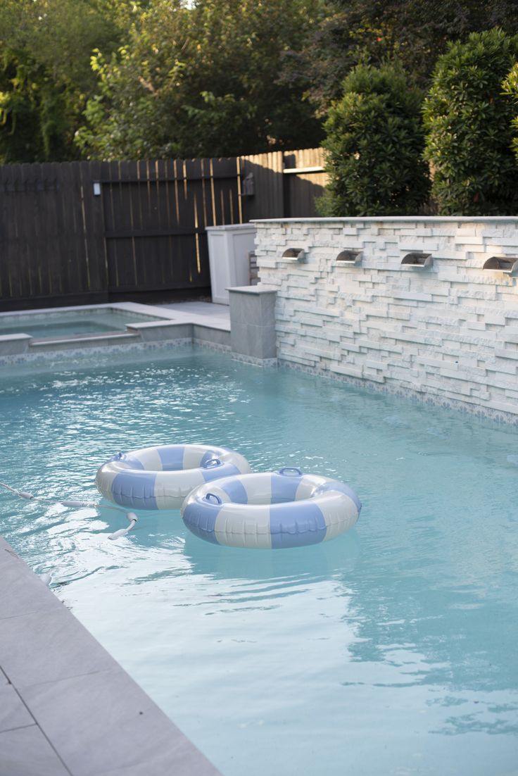 an inflatable raft floating on top of a pool