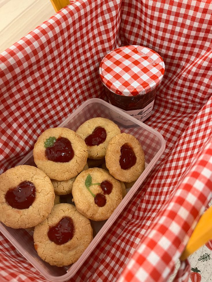 some cookies and jam in a plastic container