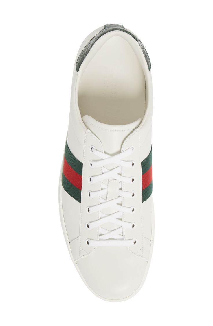 Signature webbing adds color to a clean-cut Italian sneaker shaped from supple leather for comfort. Removable insole. Leather and textile upper/leather lining/rubber sole. By Gucci; made in Italy. Men's Shoes. Italian Sneakers, Gucci Men Shoes, Sneaker Men, Gucci Men, White Leather, Men's Shoes, Nordstrom, Gucci, Italy