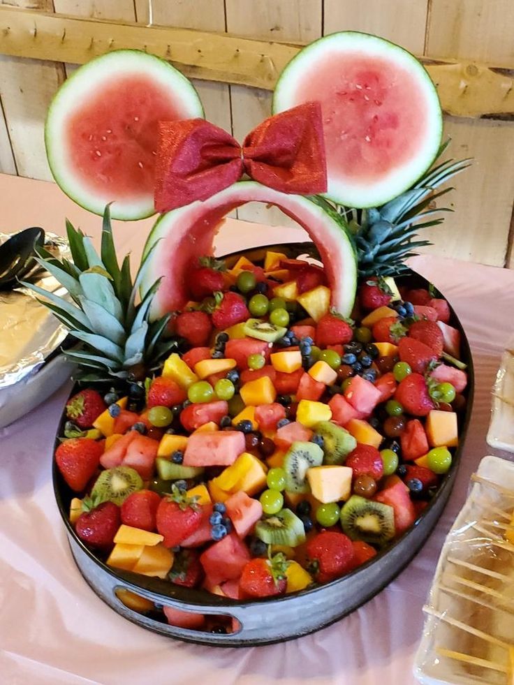 a platter filled with watermelon slices and fruit