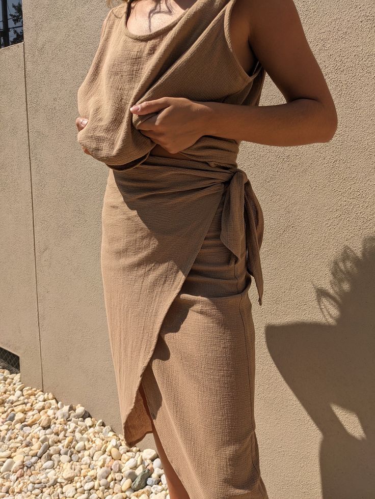 One of our all-time go-to pieces in our In House Collection - The Na Nin Bobbie Wrap Skirt; now available in our coveted waffled cotton. This piece features an elegant wrap and easy ties for an adjustable fit and feminine drape that can easily be worn high on the waist or lower on the hip depending on one's mood. Our lightweight and breathable waffle cotton feels incredible against your skin and will gracefully age and soften with wear. We envision pairing the Waffled Cotton Bobbie Wrap Skirt wi Cotton Wrap Skirt, Make Your Own Clothes, Linen Fashion, Clothing Hacks, Muslin Cotton, Toffee, Wrap Skirt, Couture Fashion, The Incredibles