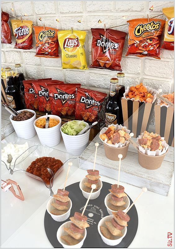 an assortment of snacks are displayed on a table