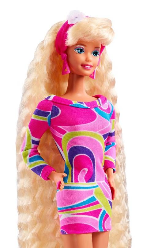 a barbie doll with blonde hair wearing a pink dress