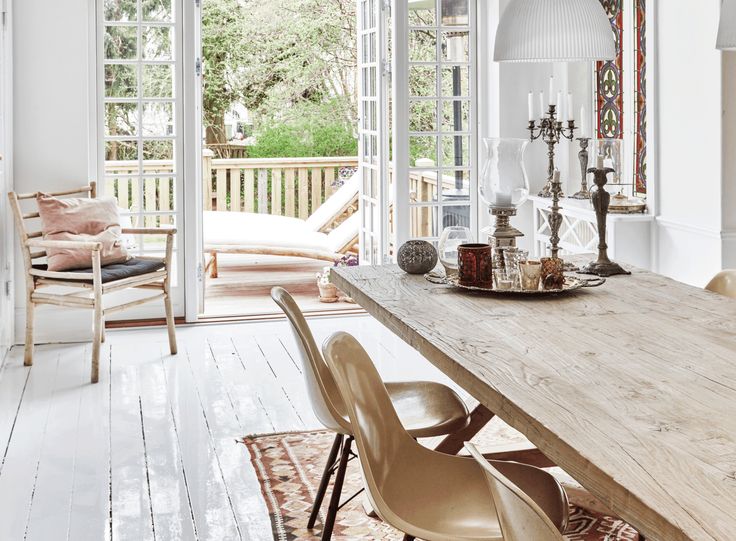 the dining room table is surrounded by chairs