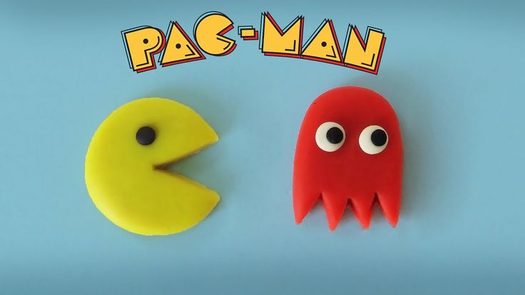 pac - man and pacman made out of play dough on a blue background with pacman's eyes