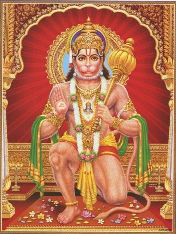 the hindu god sitting in front of a red background