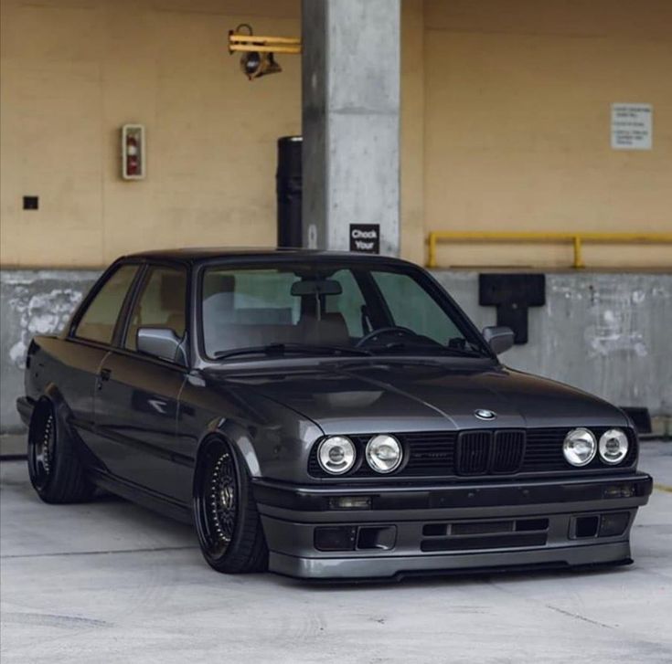 a black car parked in front of a building