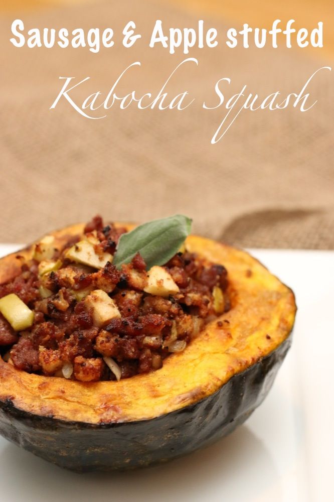 sausage and apple stuffed kabocha squash on a white plate with text overlay