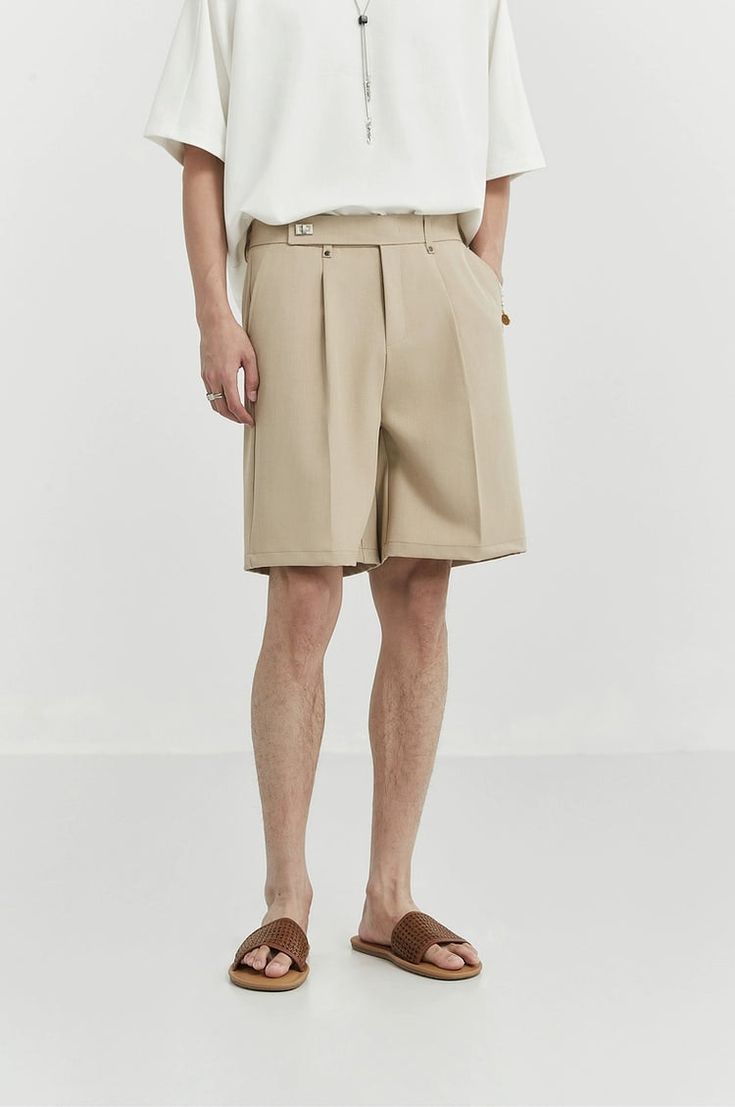 Experience tailored sophistication with our Pleated Tailored Bermuda Shorts, complete with a contemporary belt detail for a touch of edge. 

Meticulously crafted from a blend of polyester fiber and spandex, these shorts promise comfort and style. The pleated design adds texture, while the tailored fit ensures a sharp silhouette. These Bermudas make a versatile addition to your wardrobe, easily transitioning from casual outings to more formal environments. 

Pair them with a crisp shirt for a pro Spring Shorts With Belt Detail, Belted Bottoms For Business Casual Summer, Summer Workwear Bottoms With Belt Detail, Modern Spring Shorts With Belt Loops, Beige Belted Short Bottoms, Fitted Belted High-waisted Shorts, Elegant Bottoms With Short Legs And Belt Loops, Elegant Bottoms With Belt Loops, Tailored Modern Summer Bottoms