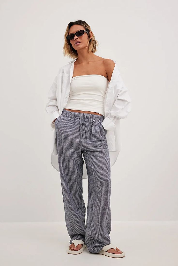 Striped Elastic Waist Linen Pants Stripe | NA-KD Striped Straight Leg Bottoms With Elastic Waistband, Casual Wide-leg Pants With Vertical Stripes, Striped Straight Leg Pants With Elastic Waistband, Casual Wide Leg Ankle-length Striped Pants, Casual Ankle-length Wide Leg Pants With Vertical Stripes, Casual Wide-leg Vertical Stripes Pants, Casual Ankle-length Bottoms With Vertical Stripes, Casual Ankle-length Pants With Vertical Stripes, Striped Pants With Elastic Waistband For Vacation