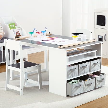 a child's desk and chair in a white room