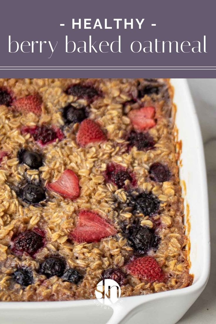 berry baked oatmeal in a white casserole dish with text overlay reading healthy berry baked oatmeal