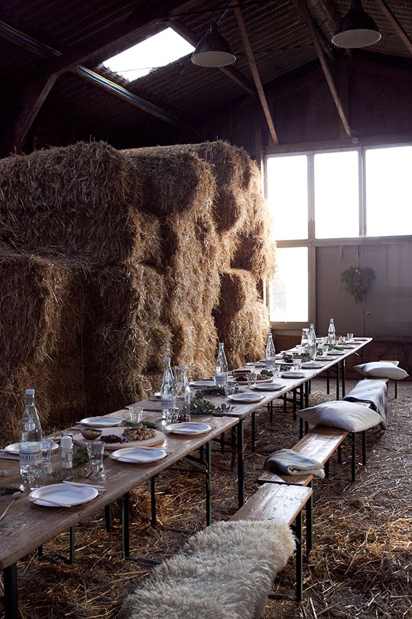 a long table set up with hay bales