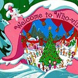 the welcome to whoville christmas card is in front of a snow covered tree and santa's sleigh