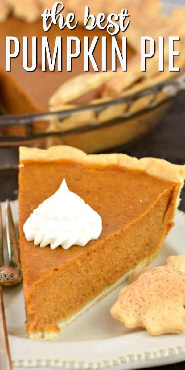 a slice of pumpkin pie on a plate with whipped cream and crackers next to it