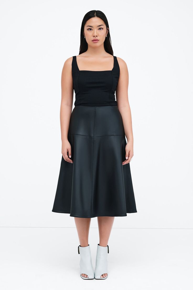 Our Lexi Skirt brings new life to the timeless A-line cut with architectural seam detailing that creates a striking silhouette. Fashioned from stretchy vegan leather with an invisible side zip, she offers an easy fit that accentuates your waist. Whether she's dressed up or down, Lexi arrives to every occasion with equal elegance. | Astrid, in black and in latte, is 5'9" (175 cm) tall, wearing size XS. Shannon, in black, is 5'8 (173 cm) tall, wearing size M. Total length is approximately 29.5" (7 Modern Fitted Leather Skirt, Fitted Flared Leather Skirt, Fitted Leather Flared Skirt, Sleek Fitted Flared Skirt, Modern Full Skirt Fitted, Modern Fitted Full Skirt, Modern Leather Pencil Skirt, Fitted Faux Leather Flared Skirt, Fitted Faux Leather Skirt For Work