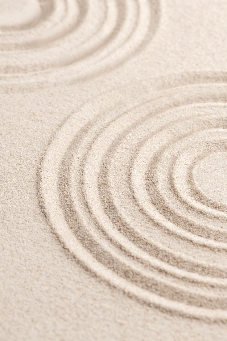 the sand has circles drawn on it