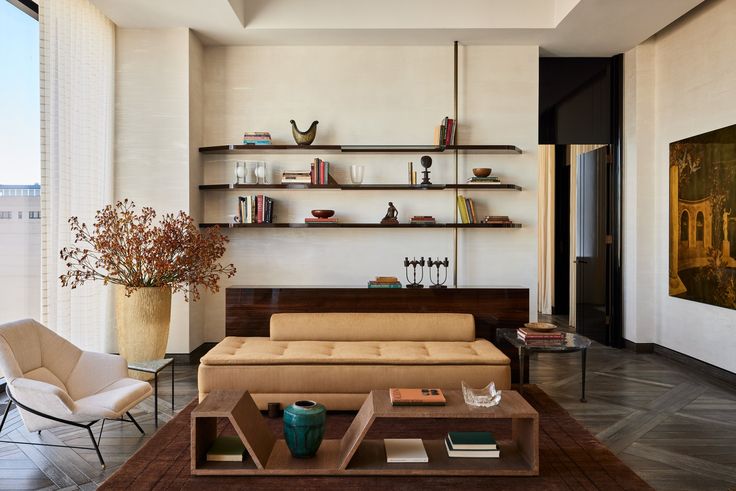 a living room filled with furniture and a large window