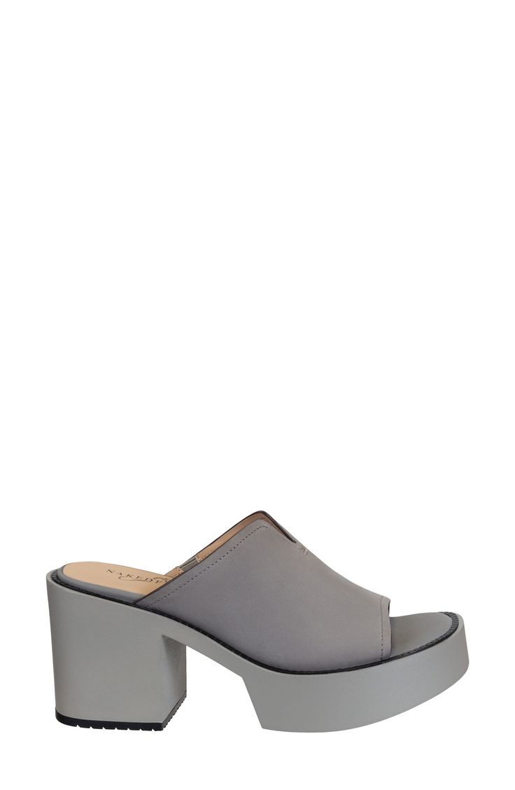 A chunky block heel elevates this chic platform mule with a soft suede strap and tailored topline delivering a modern vibe with a nostalgic twist. 3" heel; 1 1/2" platform Cushioned footbed Leather upper/synthetic lining and sole Imported Modern Chunky Platform Clogs For Spring, Modern Platform Mules With Open Heel, Modern Platform Mules For Spring, Modern Spring Platform Mules, Modern Clogs With Stacked Heel For Spring, Modern Spring Clogs With Stacked Heel, Chic Chunky Platform Clogs For Spring, Modern Platform Slippers With Padded Block Heel, Modern Block Heel Clogs For Workwear