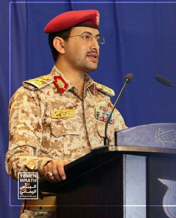 a man in uniform giving a speech at a podium