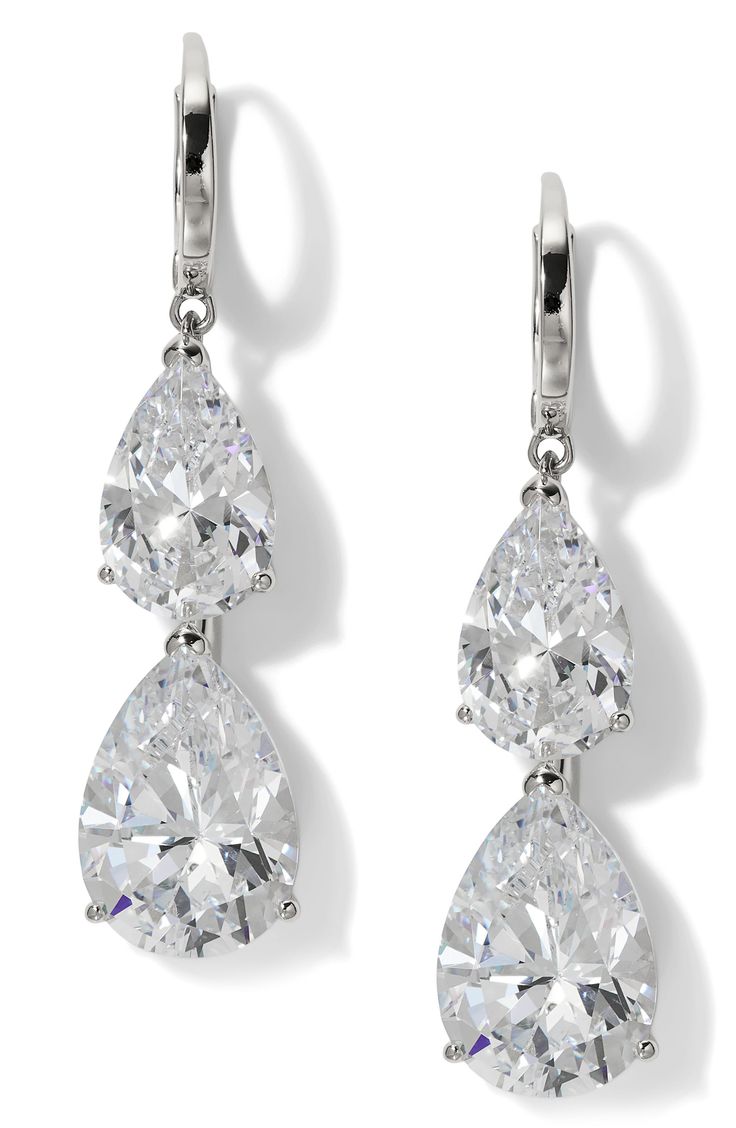 A pair of pear-shaped cubic zirconia creates an elegant aesthetic for these hand-polished earrings set in gleaming 18-karat gold plate. 1 5/8" drop; 3/8" width 18k-gold plate/cubic zirconia Imported White Gold Pear-shaped Cubic Zirconia Bridal Earrings, Pear-shaped White Gold Cubic Zirconia Bridal Earrings, Pear-shaped Cubic Zirconia Diamond Earrings, Brilliant Cut Pear-shaped Cubic Zirconia Earrings, Pear-shaped Brilliant Cut Cubic Zirconia Earrings, Elegant Pear Shaped Diamond Cut Earrings, Classic Cubic Zirconia Diamond Earrings With Polished Finish, Pear-shaped Cubic Zirconia Bridal Earrings With Prong Setting, Polished Finish Diamond Drop Earrings For Wedding